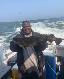 An angler with a nice codfish.