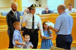 Capt. Katherine Madden takes the oath of office as her daughter