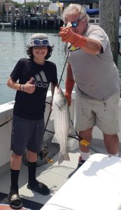 Aiden and his striped bass.