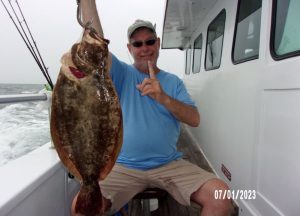 Kevin Orcutt and his 5.75-pound fluke. 