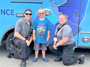 Karson Hudson, 8, of Lower Township is shown with Inspira EMTs Brian Cassidy, left, and Brittany Conrad who he dubbed his ‘Angel Buddies.’ The pair developed a special relationship with Karson while transporting him to the hospital.