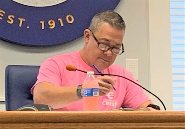 Mayor Don Cabrera signs a document at the borough’s commissioner meeting Oct. 26.