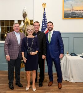 Alicia Kalil of Alicia's Balloon Boutique accepting award.