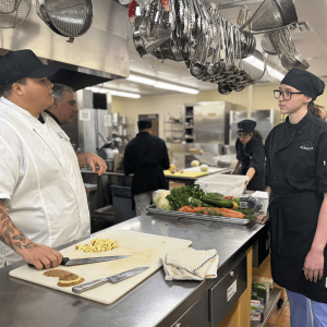 Kyle Timpson, pictured left, preparing for a mock Hell’s Kitchen cook-off competition with Cape May County Technical High School culinary students.