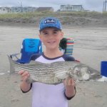 Stephen and his first striper, courtesy of Sea Isle Bait and Tackle.