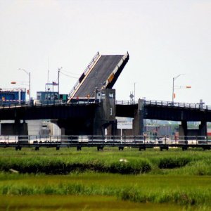 Middle Thorofare Bridge opens for boat traffic on a summer afternoon.